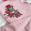 Angled view of the Christmas Nurse embroidery with a Santa hat, antlers, chevron letters and a stethoscope bow