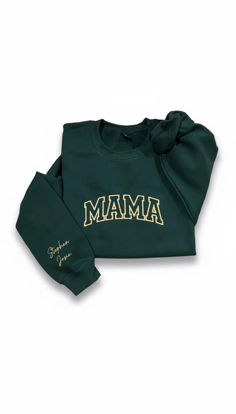 Forest green sweatshirt with arched cream varsity MAMA letters and the names Stephen and Josie in script on the sleeve
