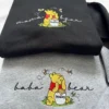 Black mama bear and grey baba bear sweatshirts, each with a yellow bear in a red shirt holding a honey pot