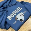 Indigo blue hoodie with BOOGIE in white varsity letters above an embroidered white and brown dog face, est. 2021