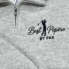 Ash quarter-zip with a navy golfer silhouette mid-swing between Best and Pépère in script, BY PAR below