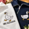 White and navy quarter-zips with a cartoon goose in sunglasses, one with a veil for MRS. SILLY GOOSE, one with a bow tie